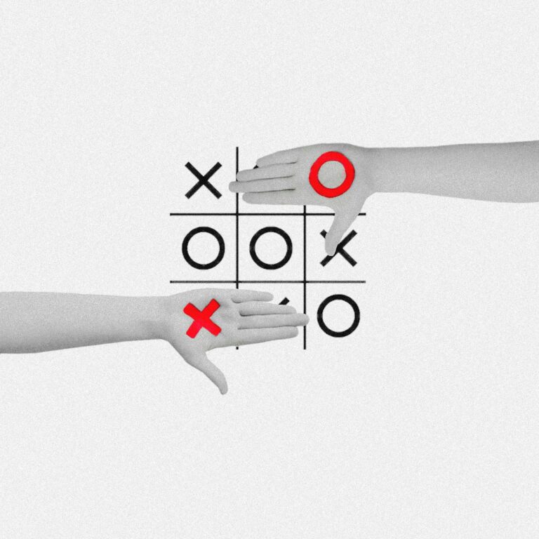 Artistic image of hands playing tic tac toe with red and black symbols, showcasing creative competition.